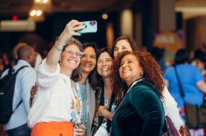 Attendees take a selfie at ONA25